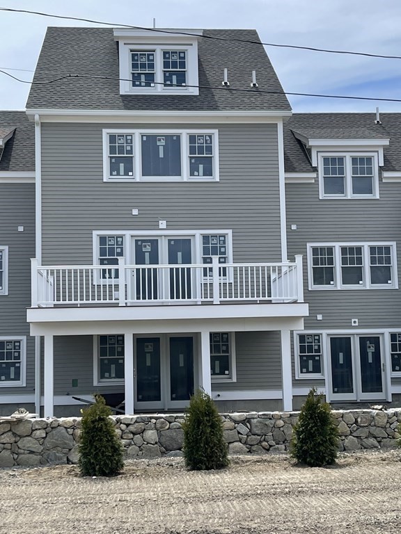 12 Main Street, Unit 13 Rowley, MA 01969 - Photo 5 of 9 a front view of a house with balcony