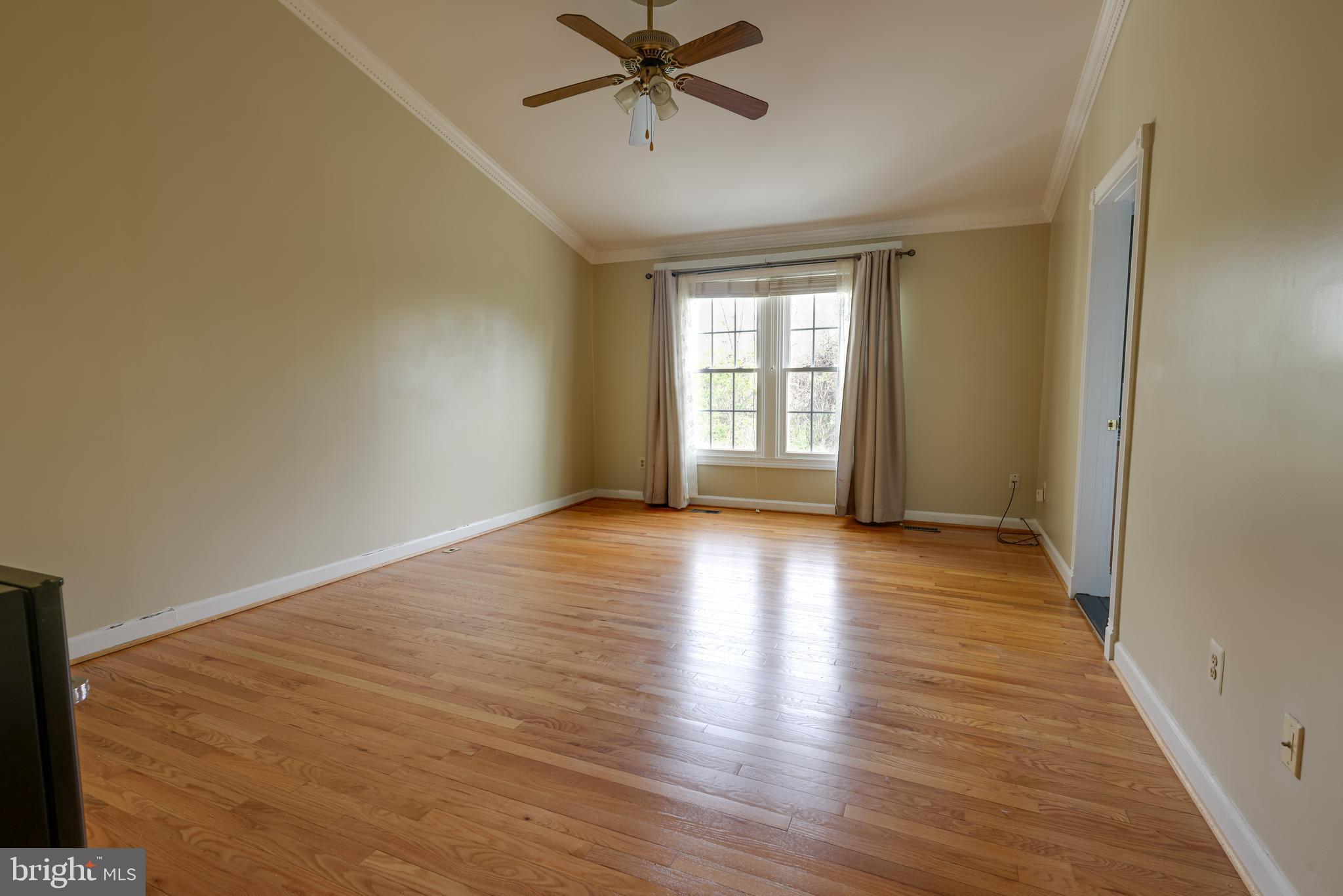 43440 Postrail Square Ashburn, VA 20147 - Photo 17 of 44 a view of a livingroom with wooden floor and a window