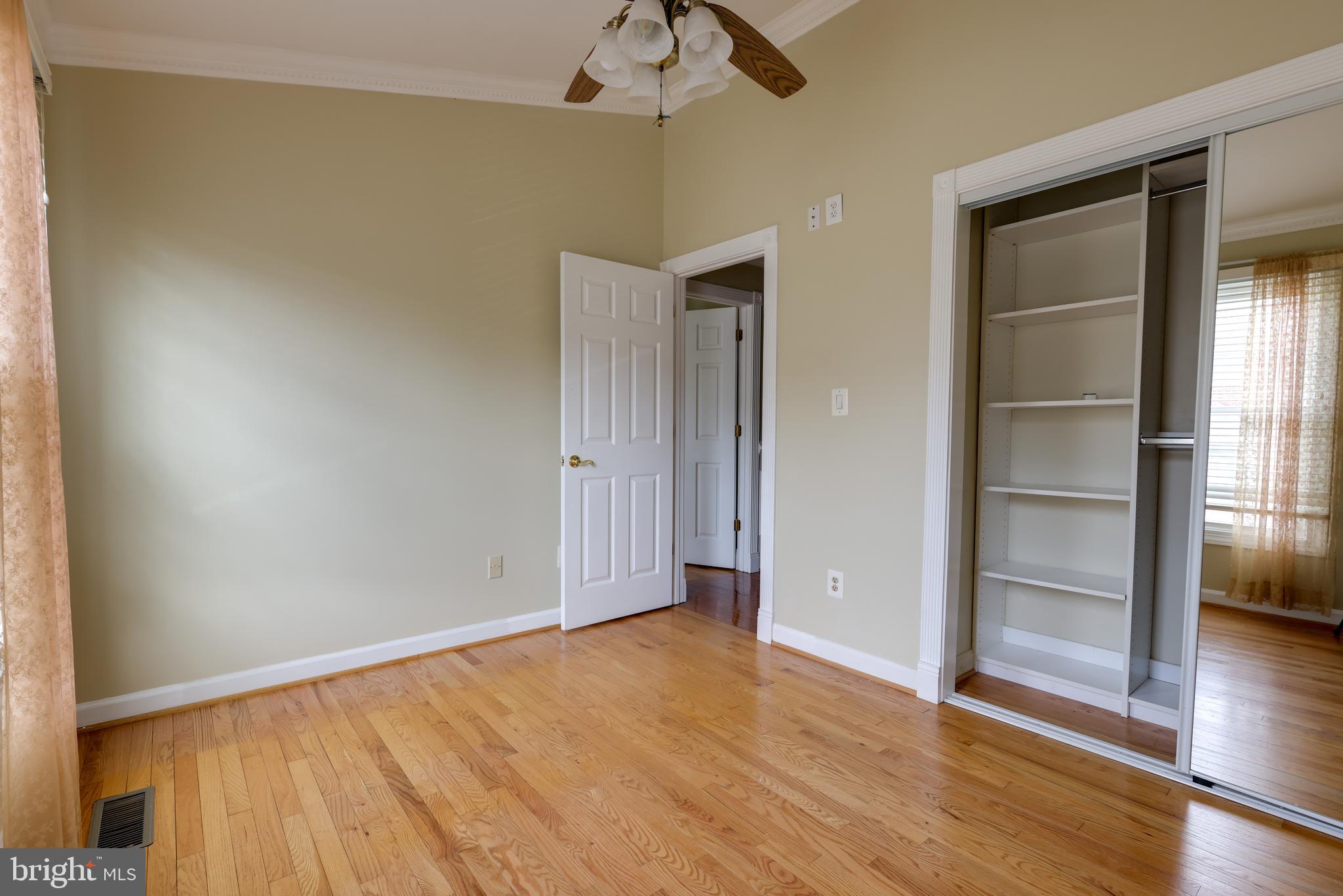 43440 Postrail Square Ashburn, VA 20147 - Photo 20 of 44 an empty room with wooden floor closet and windows
