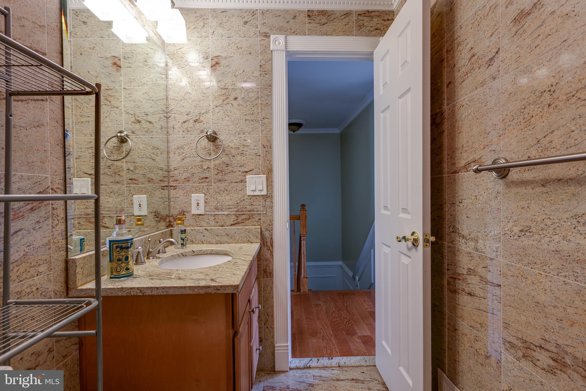 43440 Postrail Square Ashburn, VA 20147 - Photo 29 of 44 a bathroom with a sink and mirror