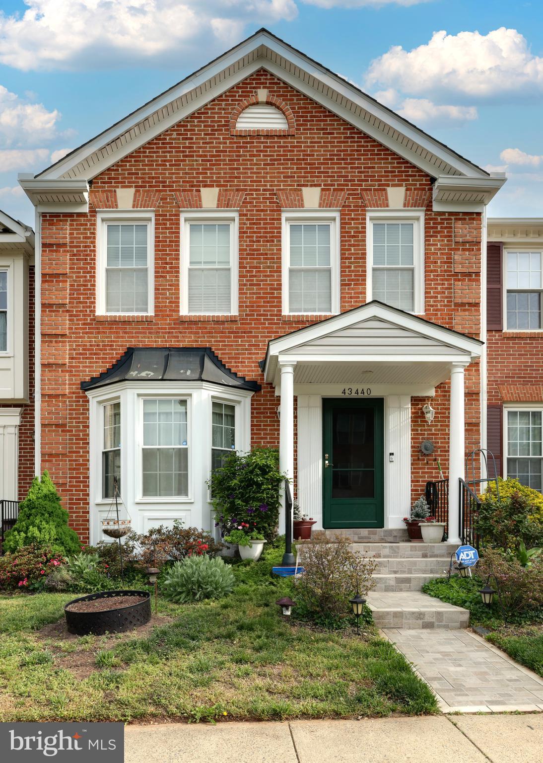 43440 Postrail Square Ashburn, VA 20147 - Photo 3 of 44 a front view of a house with garden and plants