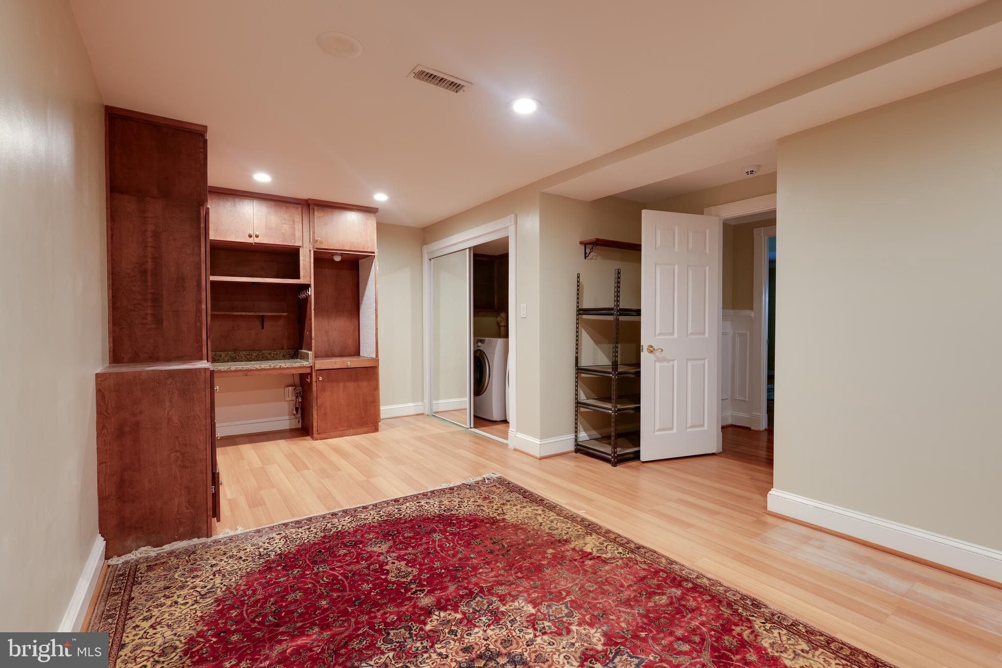 43440 Postrail Square Ashburn, VA 20147 - Photo 31 of 44 a spacious bedroom with a bed and a television in it