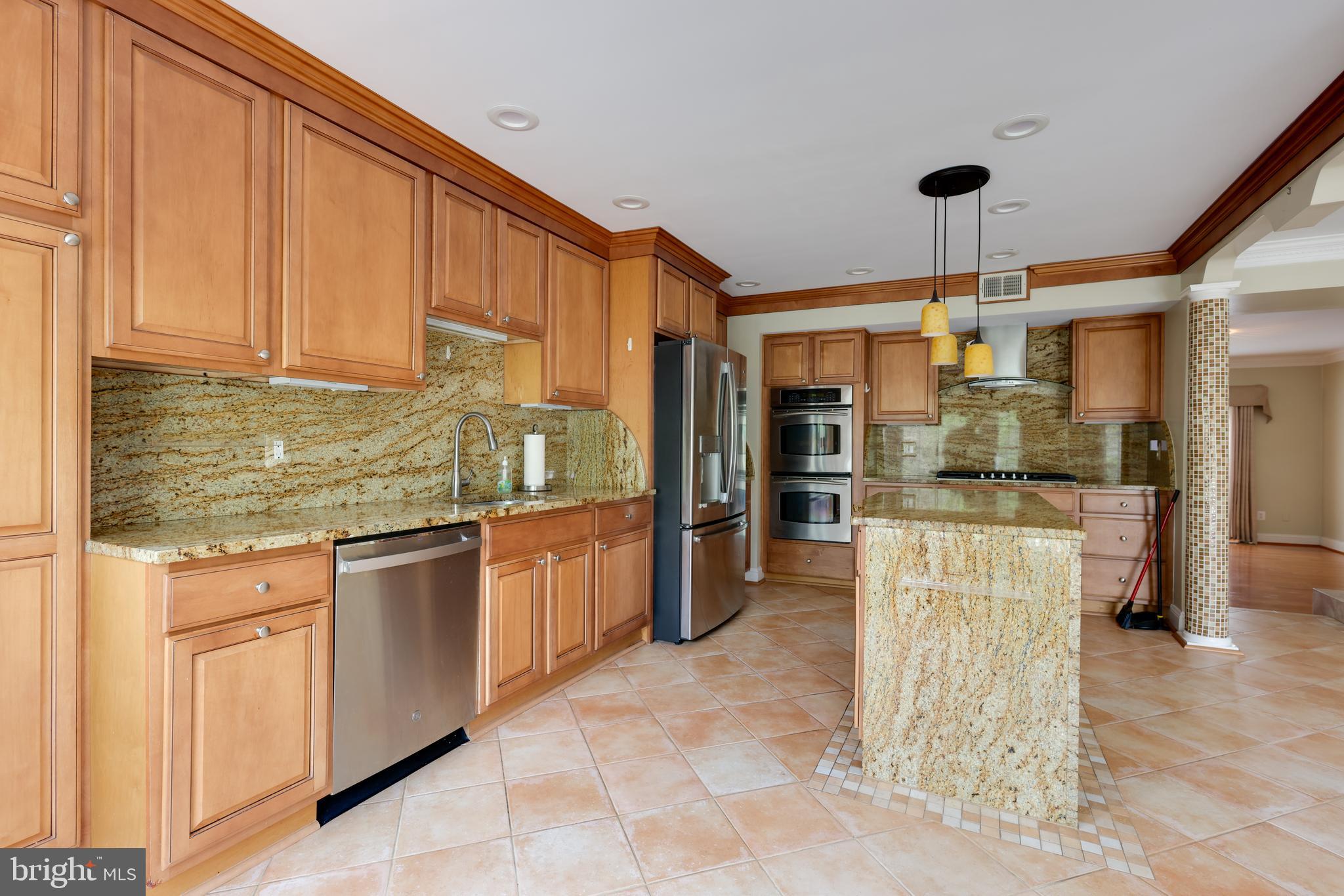 43440 Postrail Square Ashburn, VA 20147 - Photo 7 of 44 a kitchen with refrigerator and cabinets