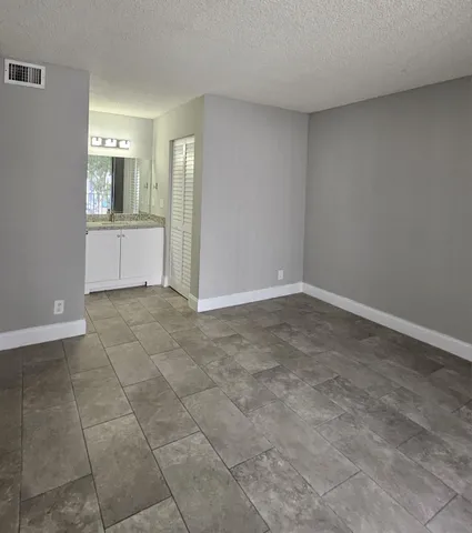 a view of a kitchen cabinets and utility room