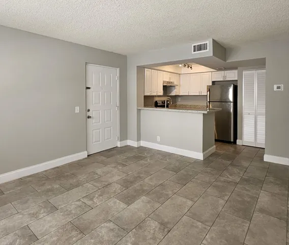 a view of a kitchen with a sink