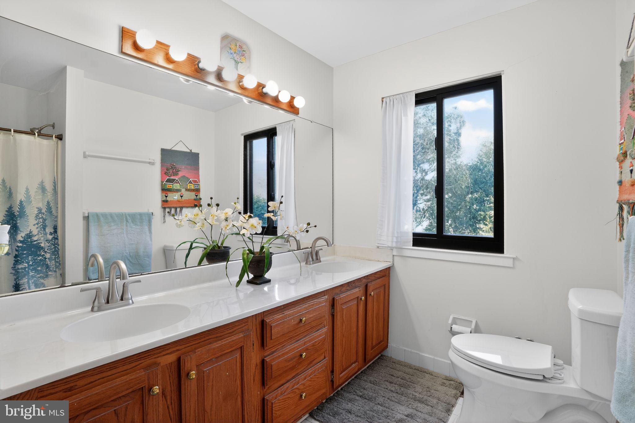 1021 Sage Road West Chester, PA 19382 - Photo 21 of 41 Full Hallway Bathroom with Bathtub & Double Sinks