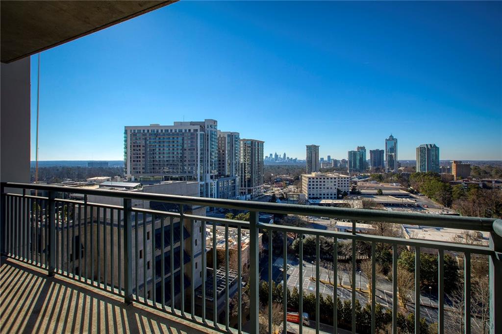 3040 Peachtree Road Northwest, Unit 1205 Atlanta, GA 30305 - Photo 1 of 1 a view of city from a balcony