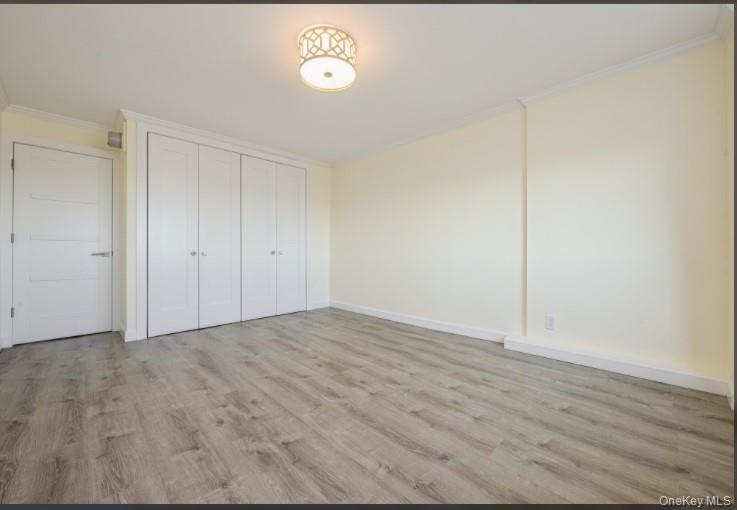 2 Bay Club Drive, Unit 17Z2 Queens, NY 11360 - Photo 12 of 17 a view of an empty room and wooden floor