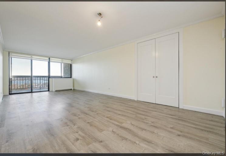 2 Bay Club Drive, Unit 17Z2 Queens, NY 11360 - Photo 8 of 17 a view of an empty room with glass door