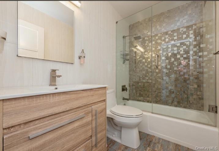 2 Bay Club Drive, Unit 17Z2 Queens, NY 11360 - Photo 9 of 17 a bathroom with a sink a toilet and shower