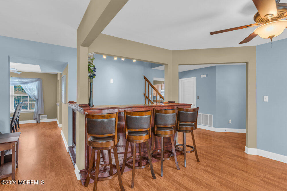 7 Andrew Street Howell, NJ 07731 - Photo 17 of 57 a view of a dining room with furniture and wooden floor