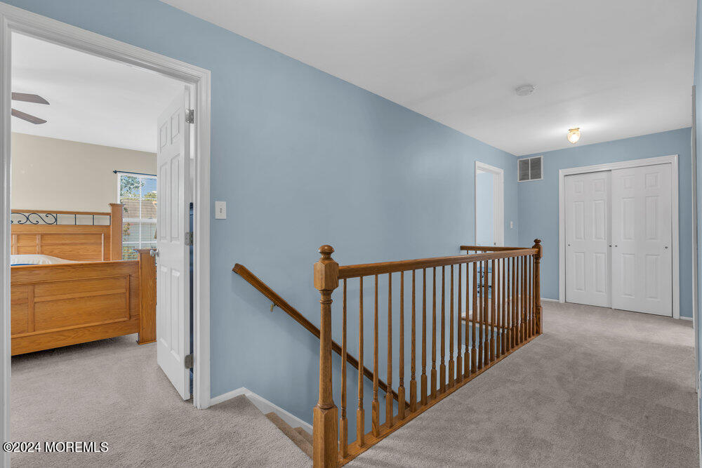 7 Andrew Street Howell, NJ 07731 - Photo 29 of 57 a view of a hallway to dining room and stairs