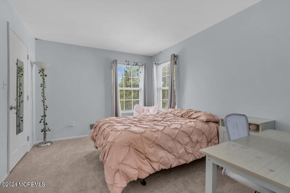 7 Andrew Street Howell, NJ 07731 - Photo 36 of 57 a bedroom with a bed and two windows