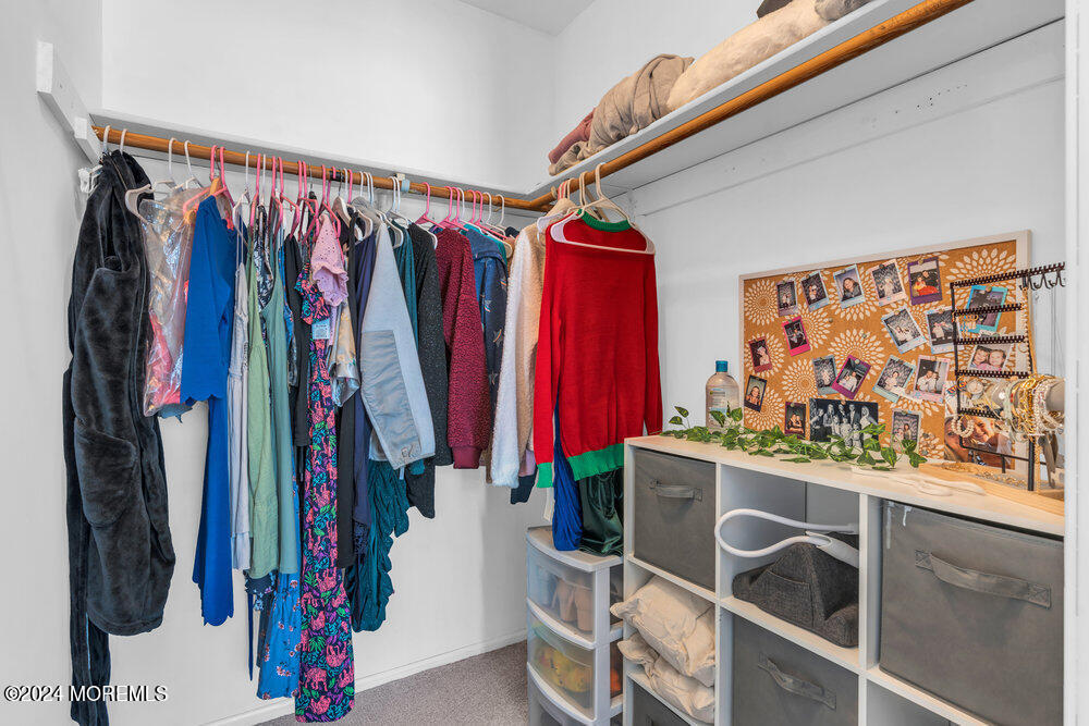 7 Andrew Street Howell, NJ 07731 - Photo 38 of 57 a view of walk in closet with clothes