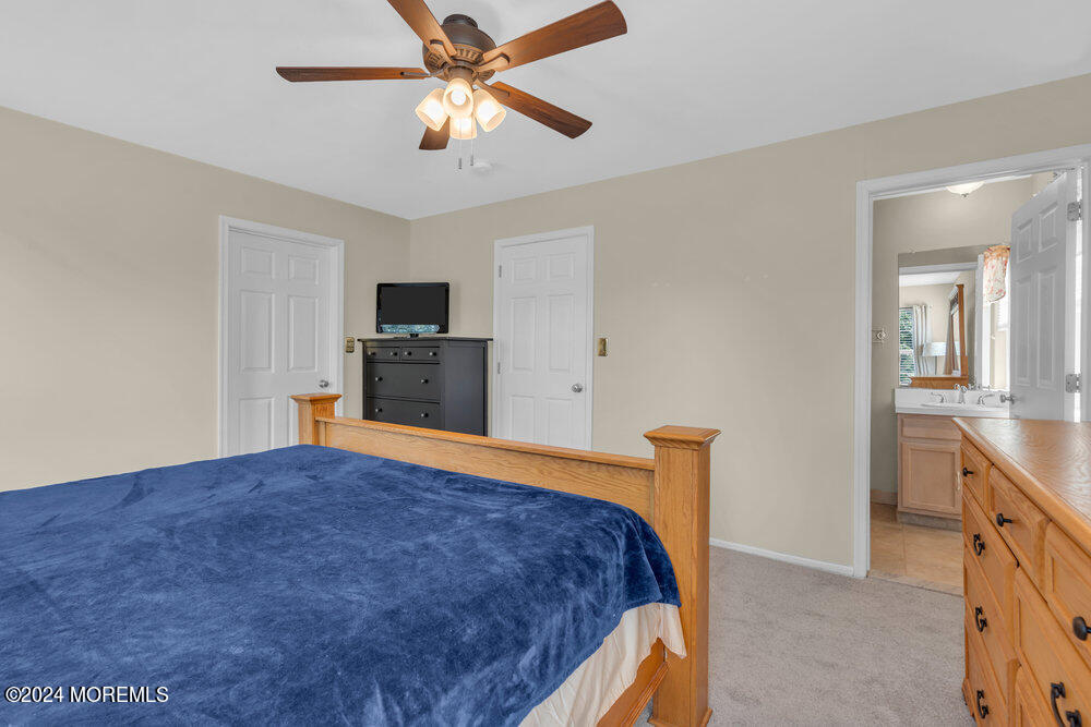 7 Andrew Street Howell, NJ 07731 - Photo 4 of 57 a bedroom with a bed and a flat screen tv