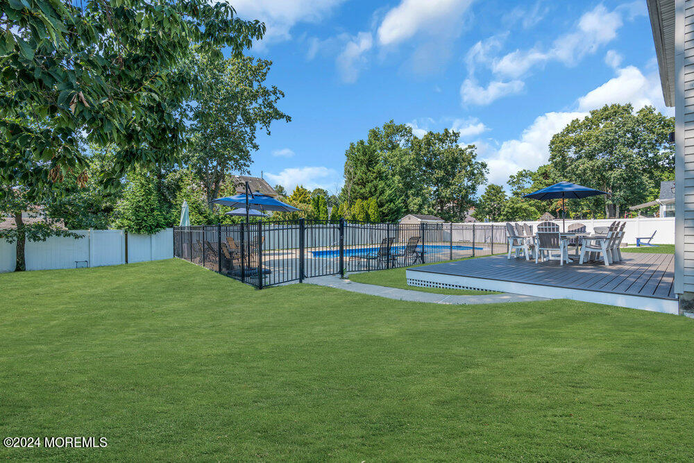 7 Andrew Street Howell, NJ 07731 - Photo 45 of 57 a view of a yard with a slide