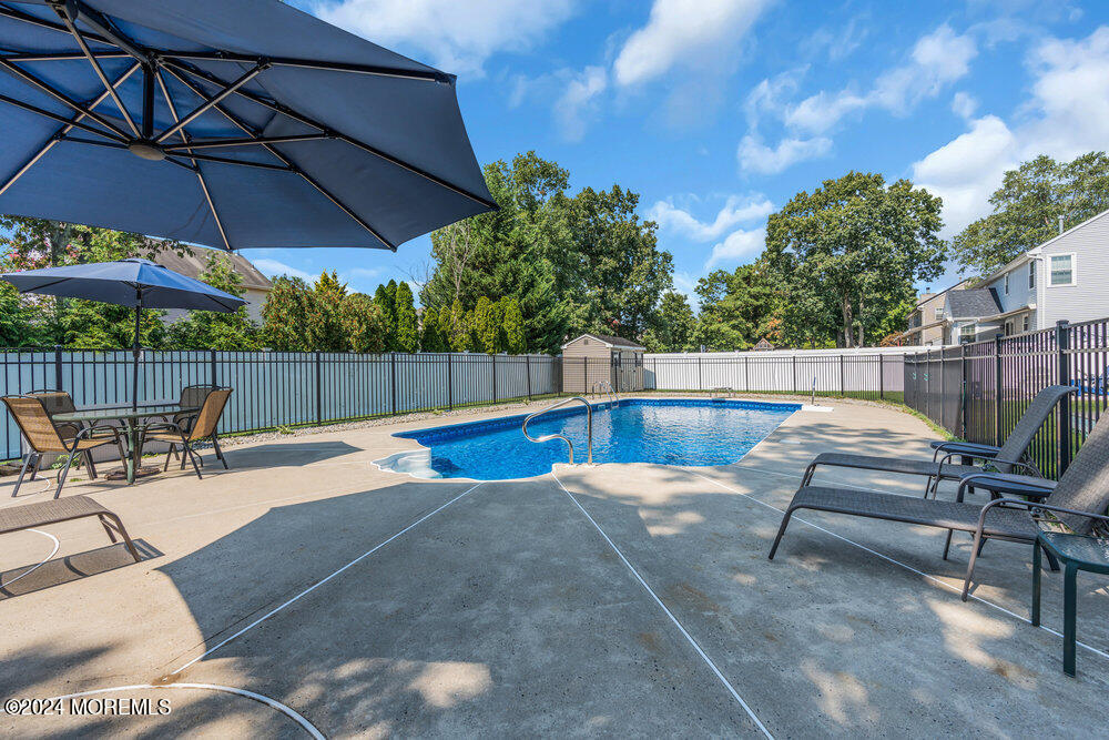 7 Andrew Street Howell, NJ 07731 - Photo 46 of 57 a view of a backyard with sitting area and furniture