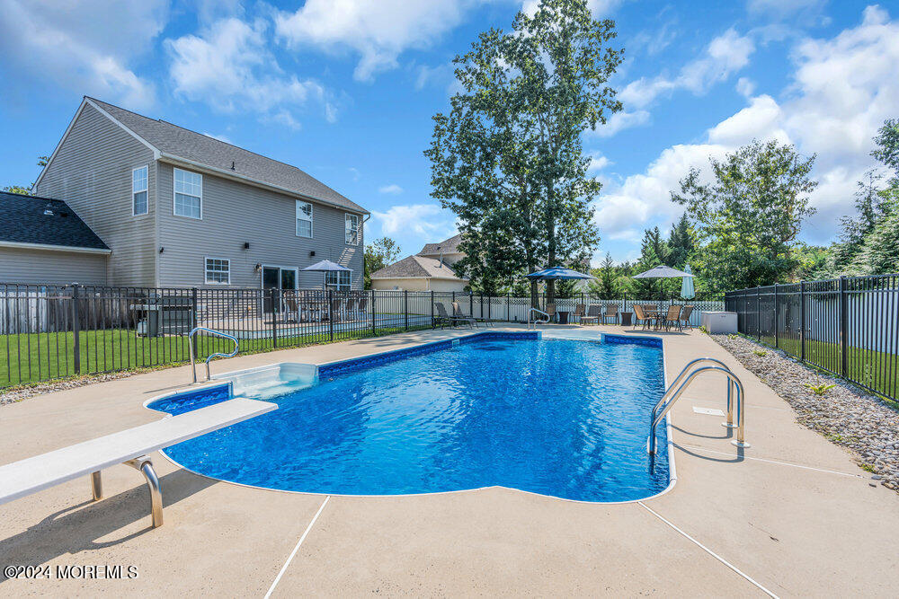 7 Andrew Street Howell, NJ 07731 - Photo 49 of 57 a view of a swimming pool with a backyard