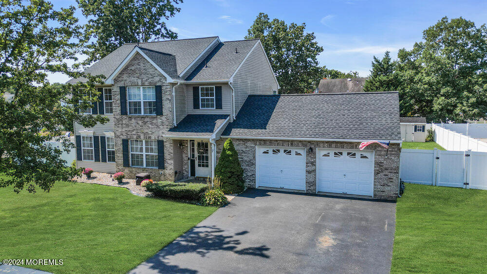 7 Andrew Street Howell, NJ 07731 - Photo 50 of 57 front view of a house with a yard