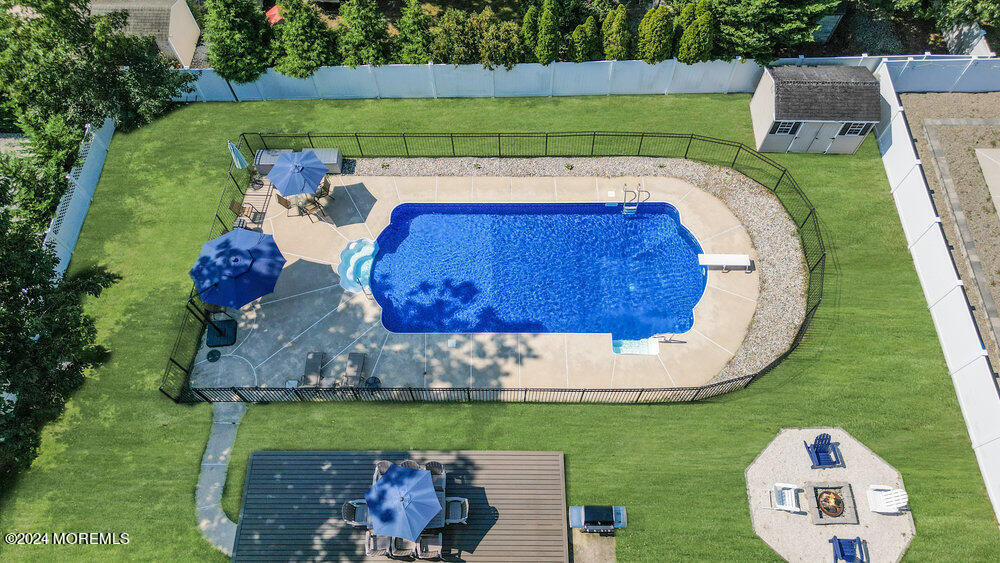 7 Andrew Street Howell, NJ 07731 - Photo 51 of 57 a view of a backyard with wooden fence