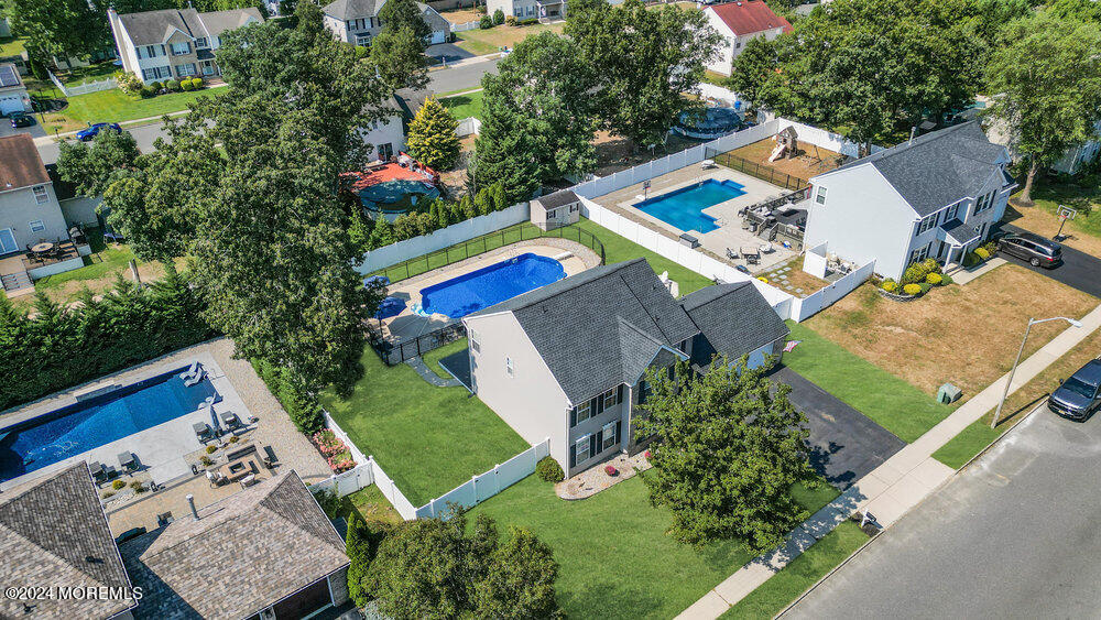 7 Andrew Street Howell, NJ 07731 - Photo 52 of 57 an aerial view of a house with a garden and swimming pool