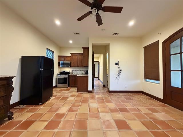 12410 Keith Road Beaumont, TX 77713 - Photo 16 of 45 a kitchen with stainless steel appliances granite countertop a refrigerator and a sink
