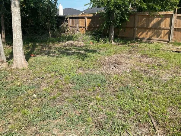 a backyard of a house with lots of green space