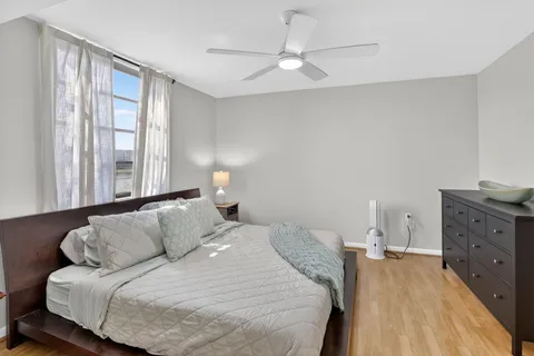 a bedroom with a large bed and a window