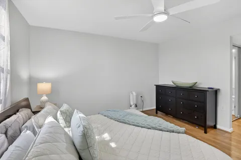 a bedroom with a bed and a dresser