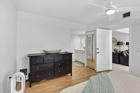a bedroom with a bed and a dresser
