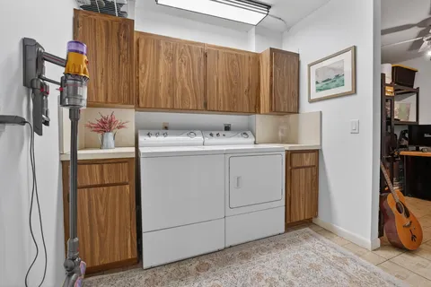 a room with a sink and cabinets