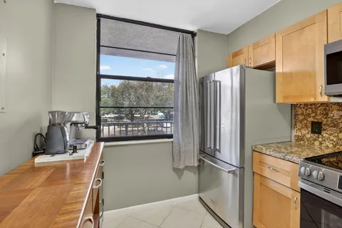 a kitchen with stainless steel appliances a refrigerator and a stove
