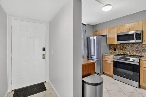 a kitchen with a stove and a microwave