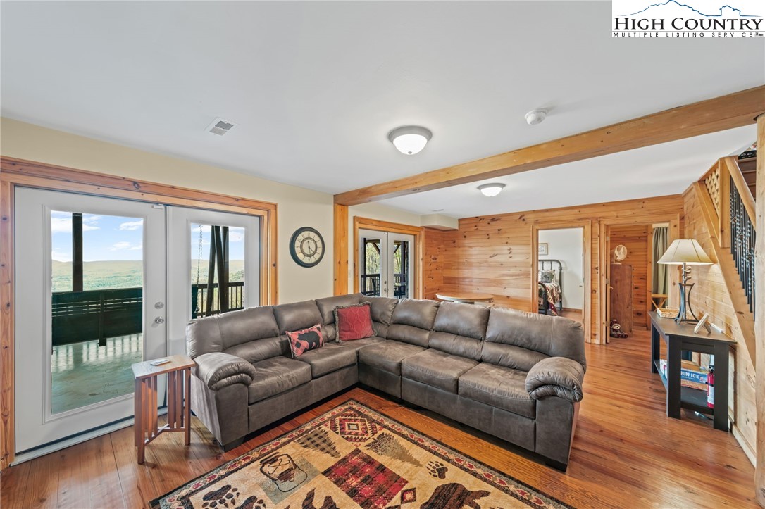 196 Eagle Nest Road Purlear, NC 28665 - Photo 24 of 36 a living room with furniture and a large window