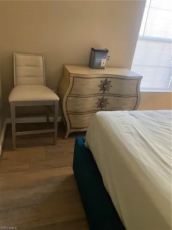 a bedroom with a bed and a cabinets