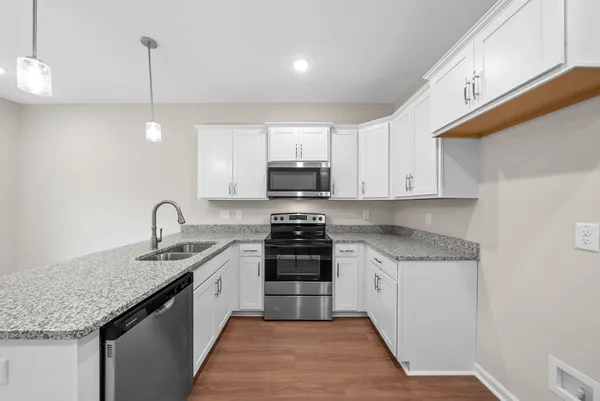 a kitchen with a stove and a sink