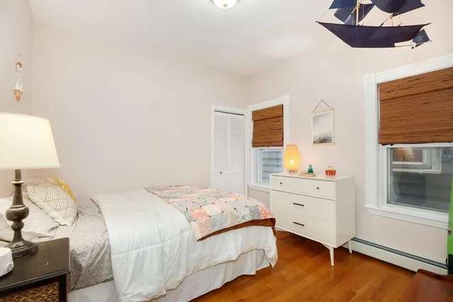 a bedroom with a bed and a dresser