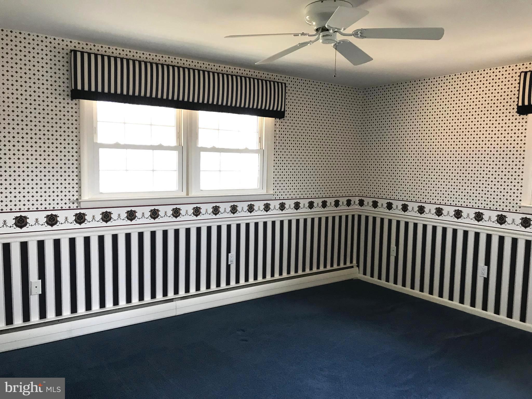 8411 Coco Road Baltimore, MD 21237 - Photo 7 of 23 an empty room with wooden floor
