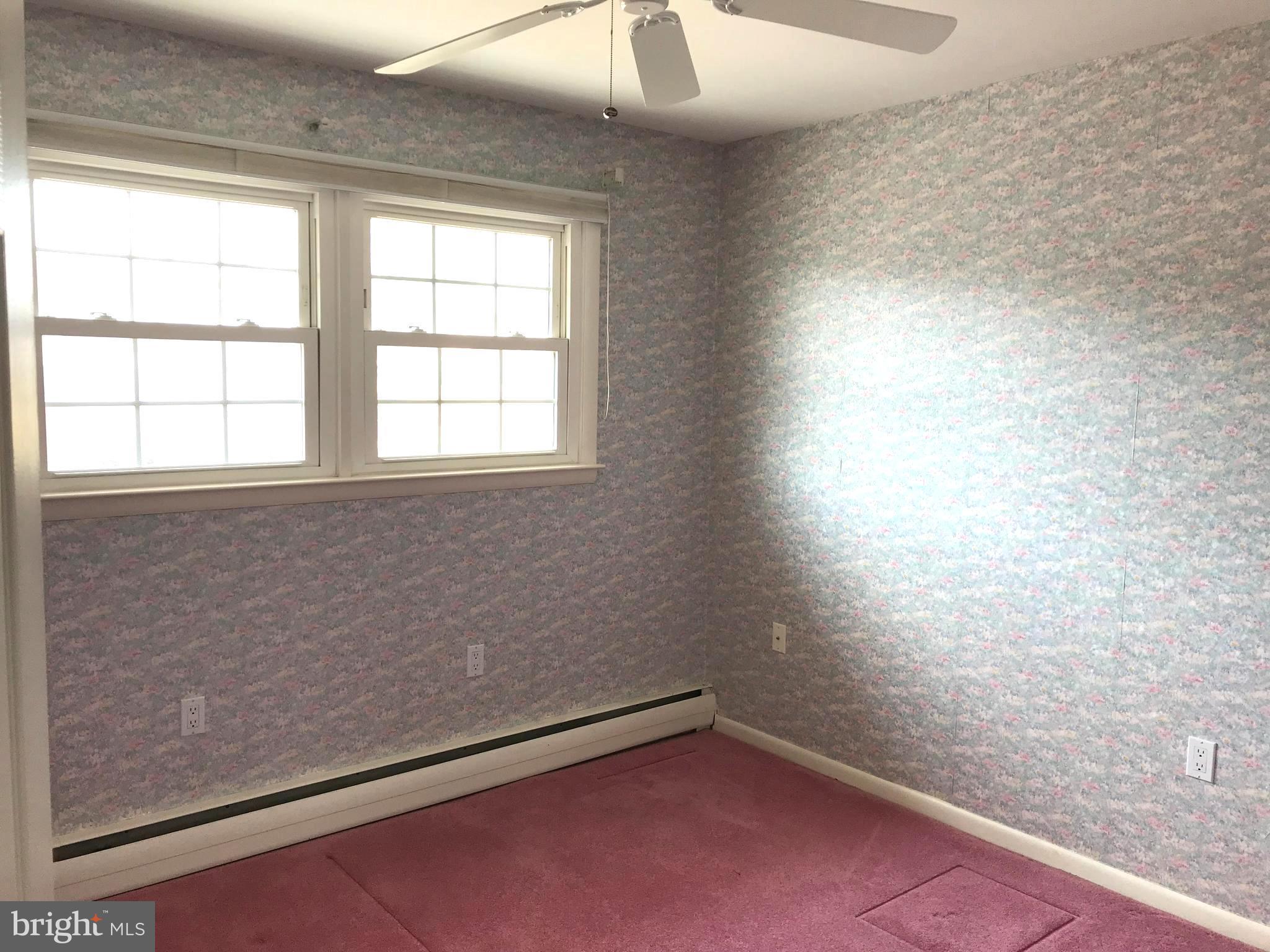 8411 Coco Road Baltimore, MD 21237 - Photo 9 of 23 an empty room with a window