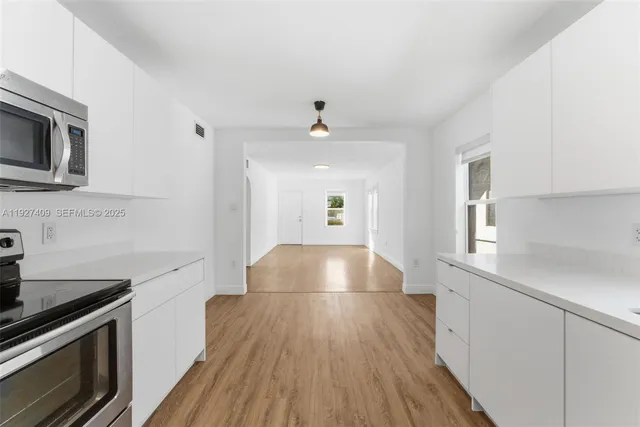 a view of a kitchen from the center