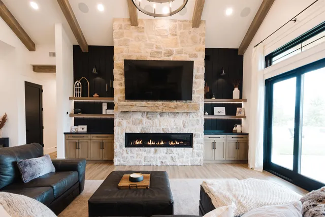 a living room with furniture and a fireplace