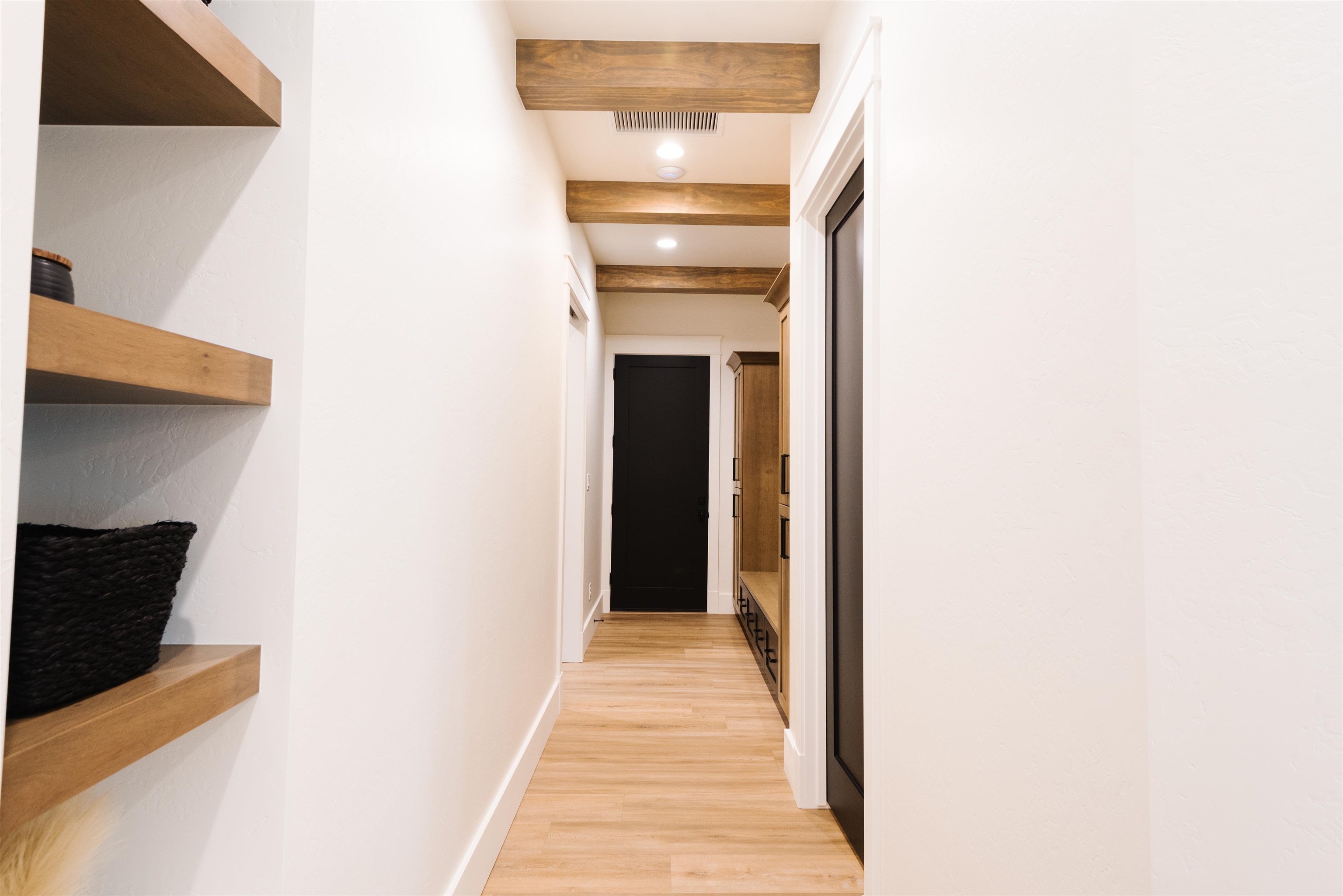 983 Farm House Road Grand Junction, CO 81505 - Photo 14 of 34 a view of a hallway with wooden floor