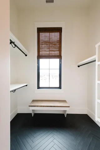 a bedroom with a bed and a table in it