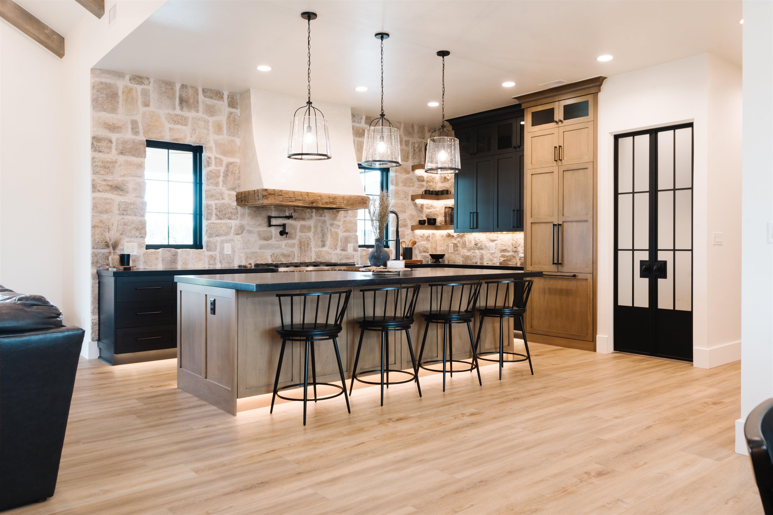983 Farm House Road Grand Junction, CO 81505 - Photo 7 of 34 a kitchen with stainless steel appliances granite countertop a refrigerator a oven a sink and a dining table with wooden floor