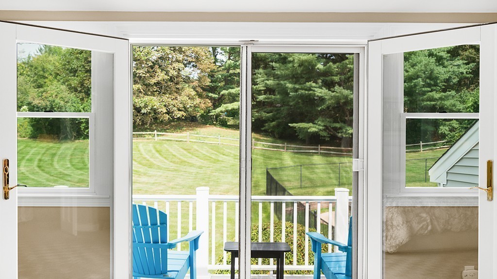 33 Oxbow Road Needham, MA 02492 - Photo 15 of 24 a view of a room and balcony with a yard
