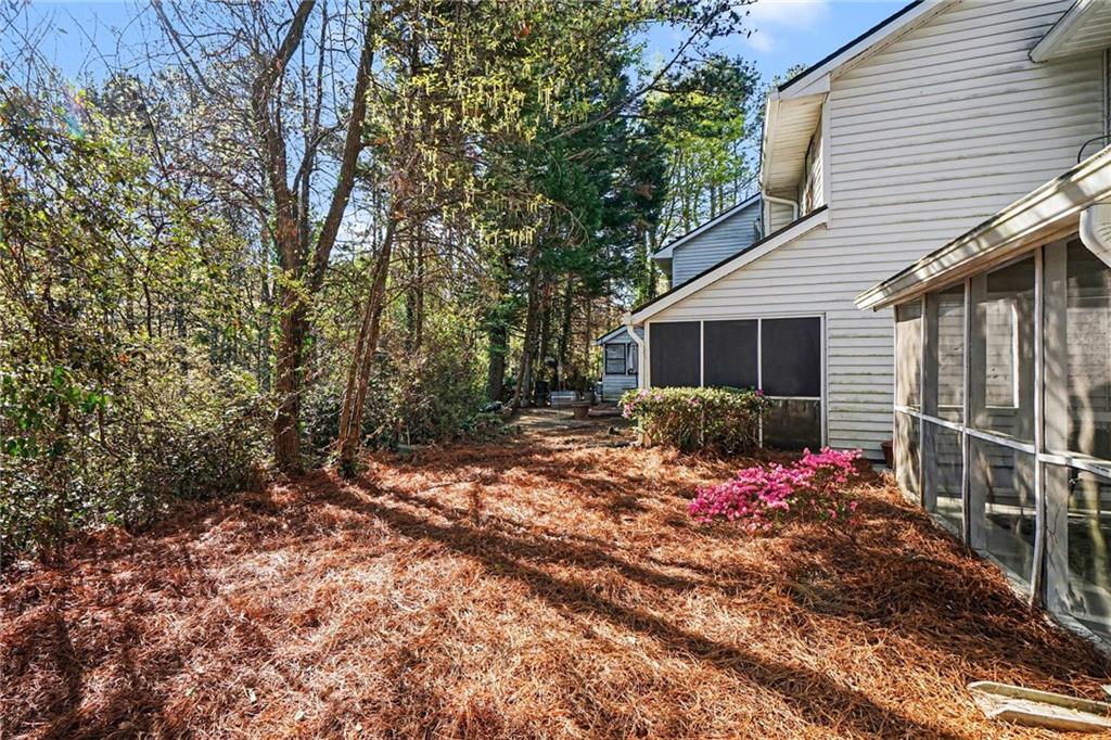 6052 WinterGreen Road Northwest Norcross, GA 30093 - Photo 22 of 24 a view of a house with a yard