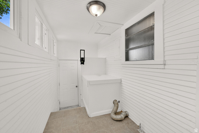 716 East Factory Street Garland, UT 84312 - Photo 22 of 30 Utility room featuring white shiplap walls, recessed ceiling with beadboard, and neutral tile flooring