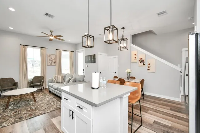 a open kitchen with sink and breakfast area