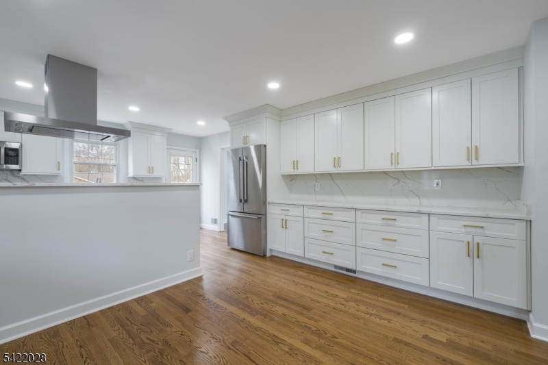 6 Windsor Way Berkeley Heights, NJ 07922 - Photo 11 of 36 a kitchen with stainless steel appliances granite countertop a refrigerator sink and white cabinets