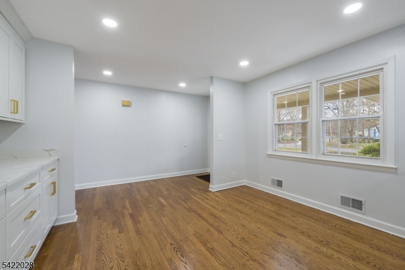 6 Windsor Way Berkeley Heights, NJ 07922 - Photo 12 of 36 an empty room with wooden floor and windows